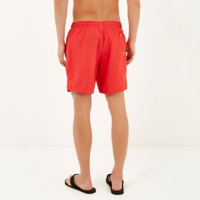 Red mid length swim shorts